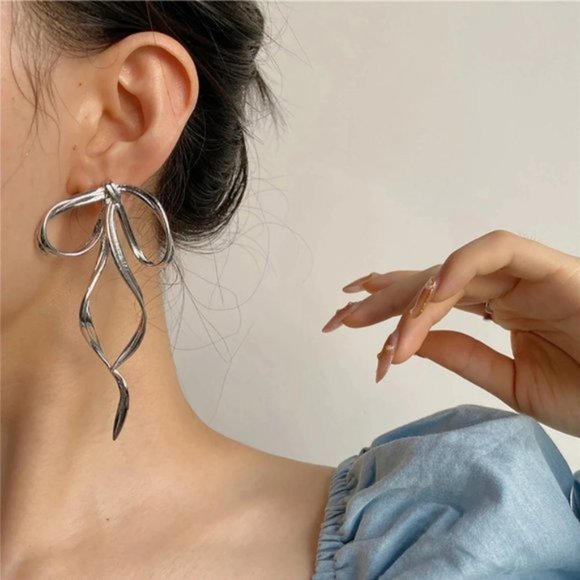 Anthro Silver Bow Earring